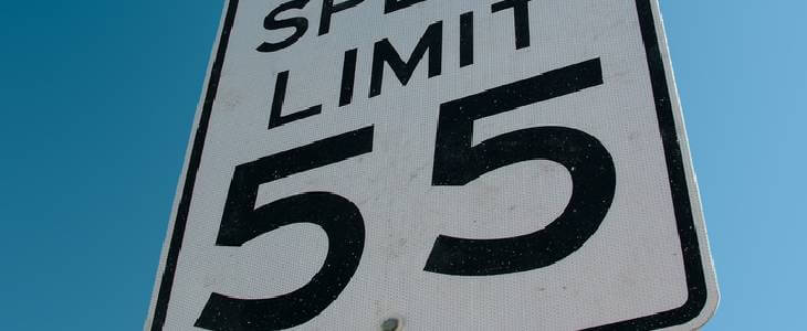 Close-up view of a 55 Miles per hour speed limit sign