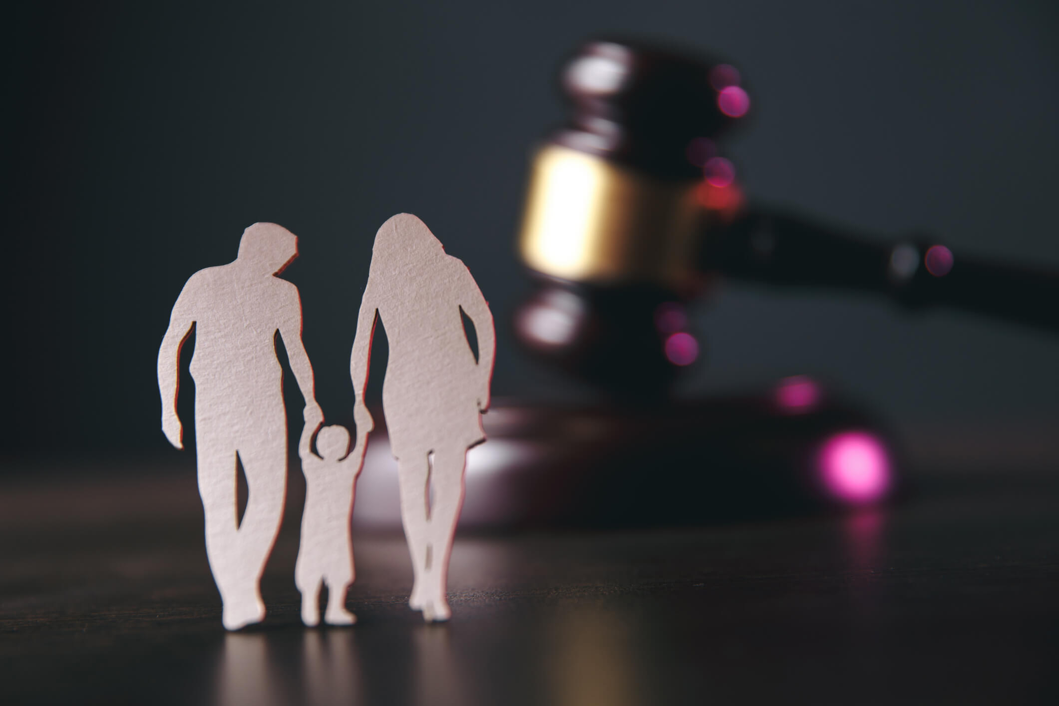 Family figure and gavel on table. Family law concept